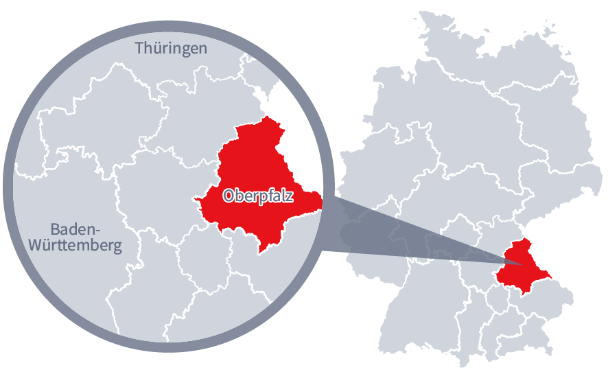 Diese Grafik zeigt eine Karte von Deutschland mit einer detaillierten Ansicht der Region Oberpfalz. Oberpfalz ist in Rot hervorgehoben und liegt im südlichen Teil Deutschlands. Ein Lupensymbol vergrößert diesen Bereich, um die Lage genauer darzustellen. 
